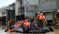 Residents on a rescue boat are evacuated from their flooded houses following Typhoon Vamco, in Rizal Province, Philippines, November 12, 2020. REUTERS/Lisa Marie David/File Photo