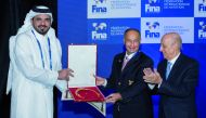 The President of the Qatar Olympic Committee (QOC), H E Sheikh Joaan bin Hamad Al Thani, is seen with the newly-elected International Swimming Federation (FINA) President Husain Al Musallam and the outgoing President Julio Maglione during the FINA General