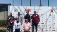 Qatar's Rashid Saleh Al Athba and Reem Al Sharshani with other podium winners and officials after winning the gold medal in the mixed skeet competition during the Arab Shooting Championship in Cairo, Egypt, yesterday.
