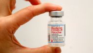 A healthcare worker holds a vial of the Moderna COVID-19 Vaccine at a pop-up vaccination site operated by SOMOS Community Care during the coronavirus disease (COVID-19) pandemic in Manhattan in New York City, New York, U.S., January 29, 2021. REUTERS/Mike Segar/File Photo