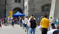 People queue to cast their votes in a series of referendums in front of a ballot station at the Stadthaus administration building in Zurich, Switzerland June 13, 2021. Reuters/Arnd Wiegmann