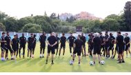 Qatar's players and team officials ahead of a training session in Rovinj, Croatia yesterday.  