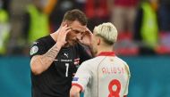 Soccer Football - Euro 2020 - Group C - Austria v North Macedonia - National Arena, Bucharest, Romania - June 13, 2021 Austria's Marko Arnautovic and North Macedonia's Ezgjan Alioski after the match Pool via REUTERS/Justin Setterfield
