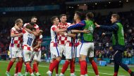 Soccer Football - Euro 2020 - Group D - Croatia v Scotland - Hampden Park, Glasgow, Scotland, Britain - June 22, 2021 Croatia's Ivan Perisic celebrates scoring their third goal with teammates Pool via REUTERS/Paul Ellis
