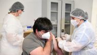 A man receives a dose of the Sputnik V vaccine against the coronavirus disease (COVID-19) at a vaccination centre in Zilina, Slovakia June 7, 2021. REUTERS/Radovan Stoklasa/File Photo