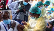 A health worker vaccinates a man against the coronavirus disease (COVID-19), in Harare, Zimbabwe, February 18, 2021. REUTERS/Philimon Bulawayo/File Photo