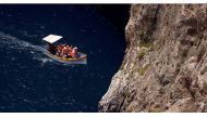 Tourists on a boat visit the Blue Grotto outside Zurrieq, Malta June 24, 2021. REUTERS/Darrin Zammit Lupi