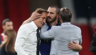 Italy coach Roberto Mancini and Leonardo Bonucci celebrate after the match Pool via REUTERS/Carl Recine
