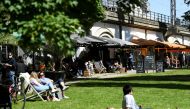 FILE PHOTO: People enjoy the warm weather as they sit outside at restaurants near James-Simon-Park, amid the coronavirus disease (COVID-19) pandemic, in Berlin, Germany May 30, 2021. REUTERS/Annegret Hilse/File Photo
