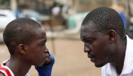 Boxer Tijani Abdulazeez, popularly known as TJ, 15, trains with his father, Abdulfathi Abdulazeez, at an outdoor boxing gym in Adura playground, in Lagos, Nigeria June 5, 2021. Picture taken June 5, 2021. REUTERS/Temilade Adelaja