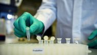 An employee of German biopharmaceutical company CureVac, demonstrates research workflow on a vaccine for the coronavirus (COVID-19) disease at a laboratory in Tuebingen, Germany, March 12, 2020. REUTERS/Andreas Gebert/File Photo