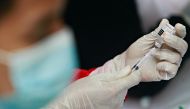 A health care worker prepares a dose of China's Sinovac Biotech vaccine for the coronavirus disease (COVID-19), during the mass vaccination program at the Tangerang City Government Center, in Tangerang on the outskirts of Jakarta, Indonesia, June 30, 2021