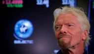 Sir Richard Branson stands on the floor of the New York Stock Exchange (NYSE) ahead of Virgin Galactic (SPCE) trading in New York, U.S., October 28, 2019. REUTERS/Brendan McDermid/File Photo