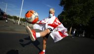  England fan with an England flag in Rome (REUTERS/Guglielmo Mangiapane)