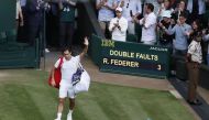 Tennis - Wimbledon - All England Lawn Tennis and Croquet Club, London, Britain - July 7, 2021 Switzerland's Roger Federer waves to the spectators as he walks off the court after losing his quarter final match against Poland's Hubert Hurkacz REUTERS/Paul C