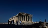 People visit the Parthenon temple atop the Acropolis hill in Athens, Greece, June 8, 2021. Picture taken June 8, 2021. REUTERS/Alkis Konstantinidis/File Photo