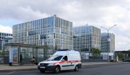 An ambulance drives near a hospital for patients infected with the coronavirus disease (COVID-19) on the outskirts of Moscow, Russia July 2, 2021. REUTERS/Tatyana Makeyeva
