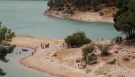 People cool off at Conde del Guadalhorce reservoir as the summer's first heatwave hits the country, in El Chorro, near Ardales, Spain July 11, 2021. REUTERS/Jon Nazca
