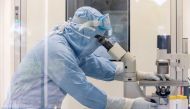A researcher works inside a laboratory during the development of the Italian ReiThera COVID-19 vaccine, in this undated handout photo in Rome, Italy. REITHERA/Handout via REUTERS/File Photo