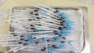 Syringes with the Pfizer-BioNTech vaccines to be administered against the coronavirus disease (COVID-19) lie on a tray during a program without an appointment in Sant Vicenc de Casteller, north of Barcelona, Spain, July 6, 2021. REUTERS/ Albert Gea