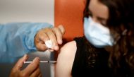 FILE PHOTO: A medical worker administers a dose of the 