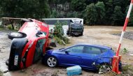 Cars destroyed by flood are pictured on a flood-affected area, following heavy rainfalls in Schuld, Germany, July 15, 2021. (REUTERS/Wolfgang Rattay)