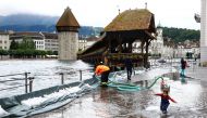 A mobile flood barrier is seen along the Reuss River in front of the Kapellbruecke bridge in Luzern, Switzerland July 15, 2021. REUTERS/Arnd Wiegmann
