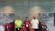 The Secretary-General of the Qatar Olympic Committee, Jassim bin Rashid Al Buenain, posing for a photograph with Qatari officials during a visit to the Athletes' Village in Tokyo, Japan, yesterday.
