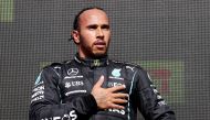 July 18, 2021 Mercedes' Lewis Hamilton celebrates on the podium after winning the race Pool via REUTERS/Lars Baron