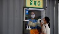 A woman gets a coronavirus disease (COVID-19) test at a coronavirus testing site in Seoul, South Korea, July 15, 2021. (Reuters/Kim Hong-Ji/File Photo)