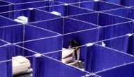 A worker prepares rooms to isolate coronavirus disease (COVID-19) patients at a shopping mall, as cases surge in Sidoarjo, East Java province, Indonesia July 19, 2021, in this photo taken by Antara Foto/Umarul Faruq via REUTERS 