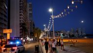 Tourists enjoy Benidorm's Levante beach at night, Spain, July 22, 2021. REUTERS/Eva Manez