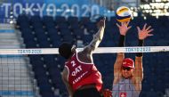 Qatar's Ahmed Tijan shoots to score against Switzerland during the Pool C Beach Volleyball match played at the Shiokaze Park in Tokyo, yesterday. Qatar's Cherif and Ahmed defeated the Swiss duo, Heidrich and Gerson 21-17, 21-16.