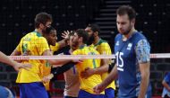 Tokyo 2020 Olympics - Volleyball - Men's Pool B - Brazil v Argentina - Ariake Arena, Tokyo, Japan - July 26, 2021. Team members of Brazil celebrate. REUTERS/Valentyn Ogirenko
