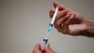 A medical worker prepares a dose of vaccine against the coronavirus disease (COVID-19) . REUTERS/Sarah Meyssonnier
