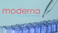FILE PHOTO: Test tubes are seen in front of a displayed Moderna logo in this illustration taken, May 21, 2021. REUTERS/Dado Ruvic/Illustration/File Photo
