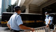 A prison van carrying Tong Ying-kit, the first person charged under the new national security law, arrives at High Court for a hearing, in Hong Kong, China, July 27, 2021. Reuters/Tyrone Siu