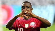 Qatar forward Al Moez Ali (19) motions after scoring a goal against El Salvador in the second half during a CONCACAF Gold Cup quarterfinal soccer match at State Farm Stadium. Billy Hardiman-USA TODAY Sports