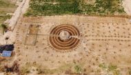 An aerial view shows participants of a Tolou Keur programme working on a newly built Tolou Keur garden in Boki Diawe, within the Great Green Wall area, in Matam region, Senegal, July 10, 2021. Picture taken with a drone. REUTERS/Zohra Bensemra