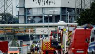 Firefighters stand outside Chempark following an explosion in Leverkusen, Germany, July 27, 2021. REUTERS/Leon Kuegeler/File Photo
