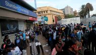 Residents queue for public transport before the extended curfew to curb the spread of the coronavirus disease (COVID-19), in downtown Nairobi, Kenya April 20, 2021. REUTERS/Thomas Mukoya/File Photo