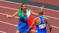 Lamont Marcell Jacobs of Italy celebrates after winning gold with Gianmarco Tamberi of Italy REUTERS/Aleksandra Szmigiel