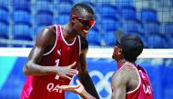 Qatar's Cherif Younousse and Ahmed Tijan celebrate their win against Lucena and Dalhausser of the US in their round of 16 match yesterday.