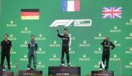 Formula One F1 - Hungarian Grand Prix - Hungaroring, Budapest, Hungary - August 1, 2021 Second placed Sebastian Vettel of Aston Martin, first placed Esteban Ocon of Alpine and third placed Lewis Hamilton of Mercedes on the podium after the race REUTERS/Da
