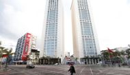 A man wearing a protective face mask walks on an empty street, following the coronavirus disease (COVID-19) outbreak, in Casablanca, Morocco March 24, 2020. REUTERS/Youssef Boudlal

