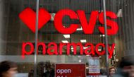 People walk by a CVS Pharmacy store in the Manhattan borough of New York City, New York, U.S., November 30, 2017. REUTERS/Shannon Stapleton/File Photo