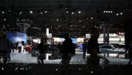FILE PHOTO:  Media members and workers are seen on the floor during a press preview day at the New York Auto Show in the Manhattan borough of New York City, New York, U.S., March 28, 2018. REUTERS/Brendan McDermid