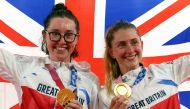 Gold medallists Laura Kenny of Britain and Katie Archibald of Britain celebrate on the podium. REUTERS/Matthew Childs