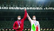 Gold medallists, Mutaz Barshim of Qatar and Gianmarco Tamberi of Italy celebrate on the podium during the medal ceremony of the men’s high jump