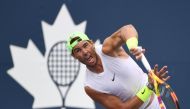Rafael Nadal of Spain hits a serve as he practices on a day off before playing in the National Bank Open at Aviva Centre. Mandatory Credit: Dan Hamilton-USA TODAY Sports